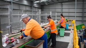 Picture of staff working to sort recycling at a Materials Recycling Facility in New Zealand