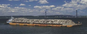 Picture of the real garbage barge, a boat of rubbish that travelled the coastline of the eastern USA looking for somewhere to dispose of the rubbish