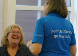 Don't let Devon go to waste written on a lady wearing a blue shirt. Opposite her is a lady smiling. This is at the CAG skill share.