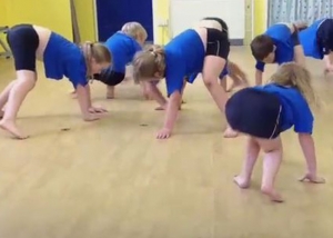 Screenshot of children crawling on floor as part of the Minibeasts Workshop