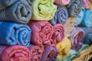 Bright colourful rolled up textiles