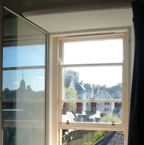 Image of a window overlooking houses
